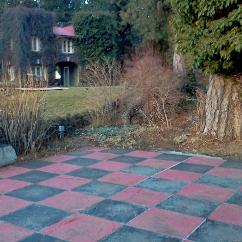 Mr Riblet installed a life-size checkerboard in front of his office turrets. What have you done with your yard recently?